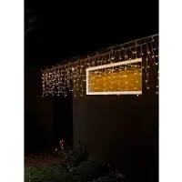 Konstsmide - LED Eisregen Lichtervorhang, mit weißen Globes, 200 bernsteinfarbene Diode, 24V Außentrafo, transparentes Kabel - 3672-803