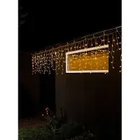 Konstsmide LED Eisregen Lichtervorhang, mit weißen Globes, 400 bernsteinfarbene Dioden, 24V, Außen (IP44), transparentes Kabel