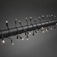 Konstsmide - LED Lichterkette, mit Lauflicht und verlängertem Steg: 4cm, 120 warm weiße Dioden, 24V Außentrafo, schwarzes Soft-Kabel; 4585-117