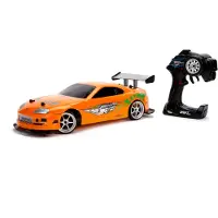 Jada Toys Fast & Furious RC-Auto, Drift 1995 Toyota Supra, Turbo, Driftfunktion, Allradantrieb, Ferngesteuertes Auto, 2-Kanal Funkfernbedienung, USB Ladefunktion, 4 Ersatzreifen, 1:10, orange