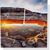 Wallario Design Wanduhr Sonnenstrahl am Horizont Leuchtende Felsspalte aus Aluverbund, Größe 30 x 30 cm