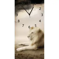 Wallario Design Wanduhr Stattlicher ruhender Löwe in Afrika in Sepiafarben aus Echtglas, Größe 30 x 60 cm