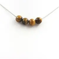 Bijoux Steine und Mineralien. Halskette mit 4 Perlen Tigerauge 8 mm Kette aus rostfreiem Stahl.