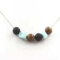 Bijoux Steine und Mineralien. Halskette Holzperlen + Lava + Larimar aus der Dominikanischen Republik 8 mm Kette aus rostfreiem Stahl.